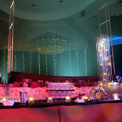A curtain of water cascaded into a bed of hydrangeas behind a bar near the back of the ballroom.