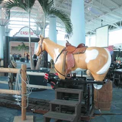 Guests climbed atop a metal horse to try their luck roping a mechanical calf.