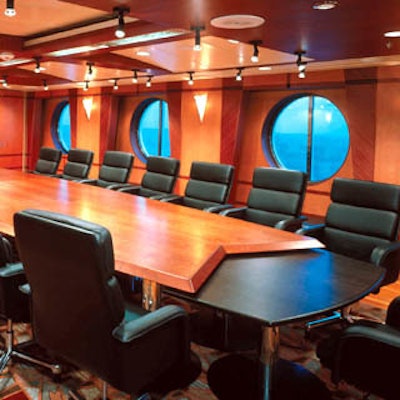 Ships are offering meeting-friendly spaces like the board room on Royal Caribbean's Voyager of the Seas.