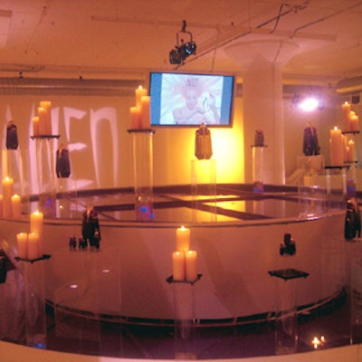 Composition Workshop built a boat-shaped centerpiece and pool surrounded by candles and perfume bottles for the Thierry Mugler Alien fragrance launch at Boylan Studio, designed by Jes Gordon.