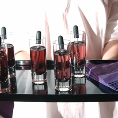Urban Events distributed purple drinks, including champagne with violet simple syrup and a blackberry reduction proffered to guests with mini medicine droppers.