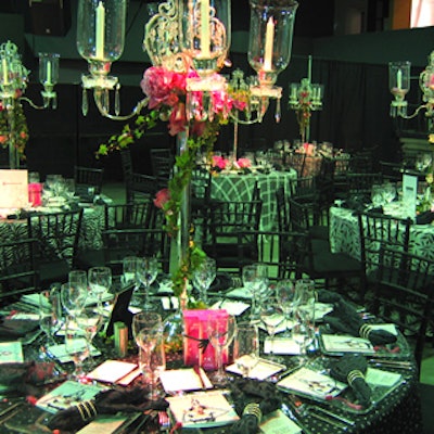 Lush florals in pink dripped from crystal and silver candelabras from Forget Me Not Flowers.