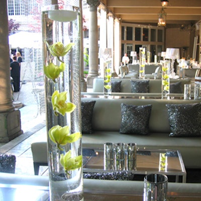 Flowers suspended in water, by Bridge the Gap, decorated mirrored tables from Contemporary Furniture Rentals in the champagne lounge.