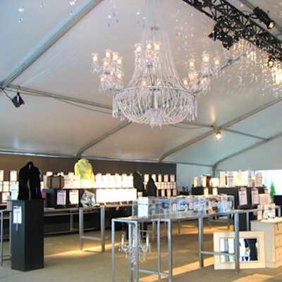 The open-air auction was held in a solid tented structure, complete with crystal chandeliers and black and silver furnishings.