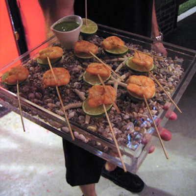 Hors d’oeuvres from Shiraz NYC, creatively titled “after-surf snacks,” were served on Lucite trays filled with starfish and shells.