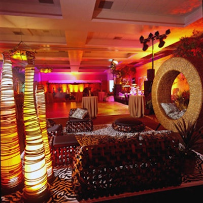 Burnt bamboo chairs, hammocks and bent-wood couches from Modern Props topped zebra-print rugs, transforming the conference center into a lounge inspired by the Imax film, Wild Safari 3D.