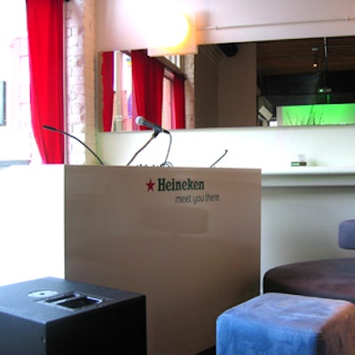 A DJ booth was branded with the Heineken logo.