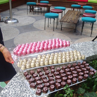 Servers passed trilevel Lucite trays packed with chocolates.