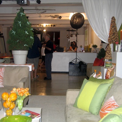 Yellow and green-accented throw pillows covered suede couches.