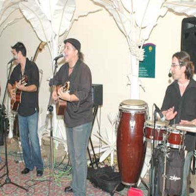 A conjunto played Cuban country music called guajira in the foyer next to a silent auction.