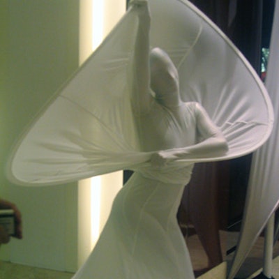 The room was flanked with stretch fabric by Pink Inc. and a dancer performed within the fabric.