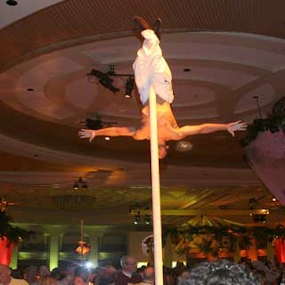 Guests watched Chinese pole dancers scurry up a 16-foot pole in time to music.
