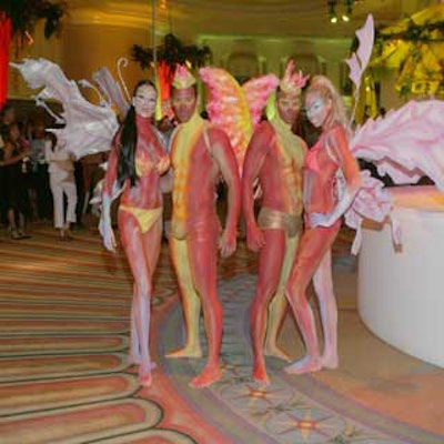 Models in neon body paint and barely-there costumes represented birds and nature goddesses.