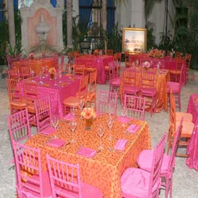Panache and Nuage Designs dressed the tables in bright orange and hot pink linens for a sit-down dinner at Vizcaya.