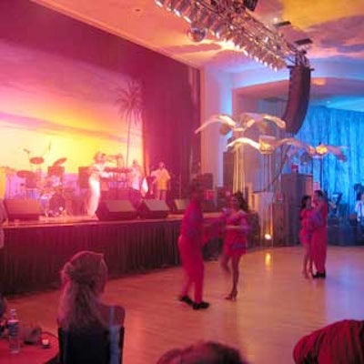 At the WEC closing night gala, a band played salsa music while dancers performed before asking guests to join in.