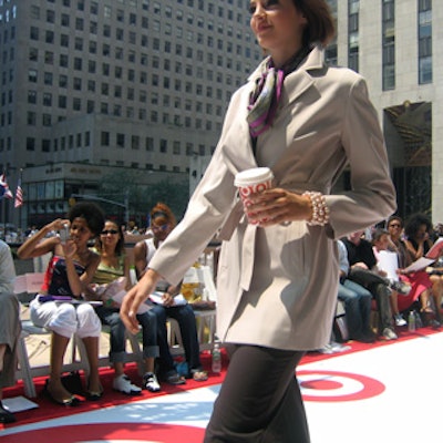 Models carried everyday items—like a disposable coffee cup—covered with the Target logo down the runway.