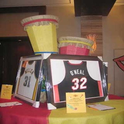 Some auction tables were decorated with oversize red and yellow conga drums, which were used to prop up large items.