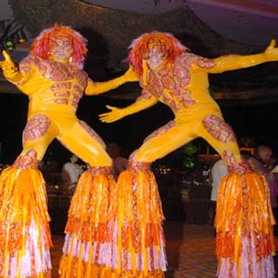 Stiltwalkers dressed in festive costumes greeted guests as they entered the ballroom.