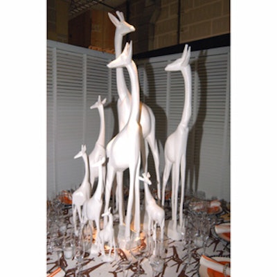 Dransfield & Ross topped its sleek table with towering, sleek white statues of giraffes.