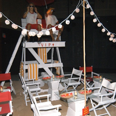 Marco Pasanella’s area featured two real lifeguards who sat atop towers watching over the guests during dinner.