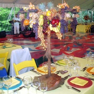 Miniature trees wrapped in coconut fibers and adorned with edible fruit sat on each dinner table.