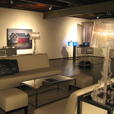 Silver and glass furniture and decor from Contemporary Furniture Rentals gave the space a James Bond-inspired urban look.