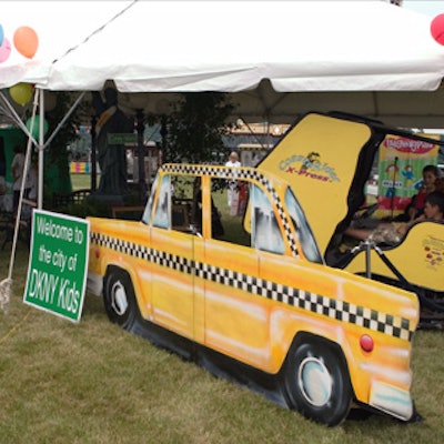 A yellow cab prop decorated Donna Karan's New York-themed 'City of DKNY Kids' tent at the Ovarian Cancer Research Fund's Super Saturday shopping event.