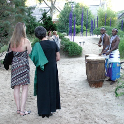 The sounds of drummers led by Rwandan musician Jean-Paul Samputu guided guests to LongHouse Reserve's 'African Odyssey' benefit at the reserve.