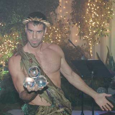 Christopher Oz, dressed as the fairy king Oberon, entertained guests during the reception by juggling glass spheres.
