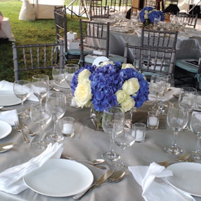 Silver tablecloths, deep blue hydrangeas, and white roses decorated the dinner in Bridgehampton celebrating Karen Brooks Hopkins’ 25 years of service to the Brooklyn Academy of Music.