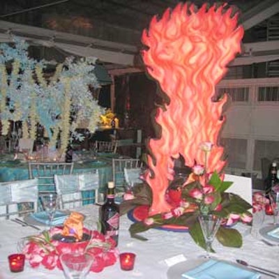 To go with the 'Icy Hot' theme of the National Association of Catering Executives' 11th annual Taste of NACE fund-raiser, red roses and votives flanked Creations Productions' fiery revolving centerpiece.