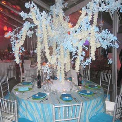 Boca by Design competed with the fiery colors of other areas, with an icy-hued table with blue linens, silver chairs, and white and blue flowers suspended above the plates.