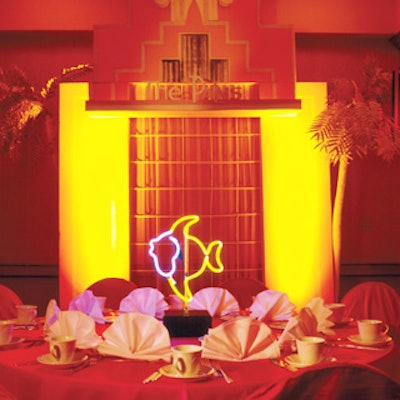 Neon flamingos, fish, palm trees, and abstract shapes adorned each dinner table.