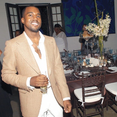 The rapper posed in an intimate dining room decked out in chocolate-brown hues and seashells.