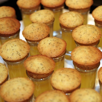 Orange poppy-seed mini muffins resting atop orange-juice shooters were handed to guests during the event.