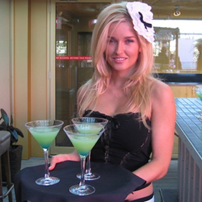 Greeters in French maid costumes from Moxie Promotions served green cocktails to arriving guests at the Drake Hotel's Sky Yard during the North American launch of the Red Soul and Soul Edge jeanswear labels.