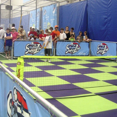 One of the tennis games in the SmashZone featured transition tennis balls—larger, foam balls that don't bounce as far as traditional balls—and a fun, small checkered court to make hitting a few volleys easier for kids.