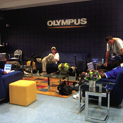Olympus catered to photographers shooting the open with a lounge where they could take a break from the heat, drop off their cameras for a cleaning, and print free digital photos.