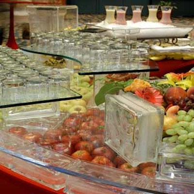 Smoothies were served from a bar made of spandex-covered tables topped with fresh fruit under glass blocks and plexiglass.