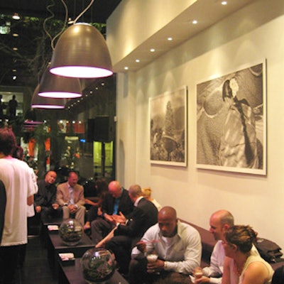 Black leather couches from Moroso and Artemide light fixtures decorate the café.