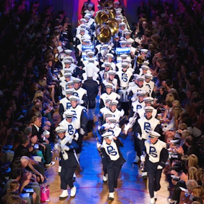Marc Jacobs’ spring 2006 collection opened with a fun performance of Nirvana’s “Smells Like Teen Spirit” performed by the Penn State marching band.