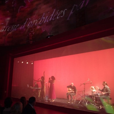 Nouvelle Vague performed from behind a curtain, on which images of orchids danced.