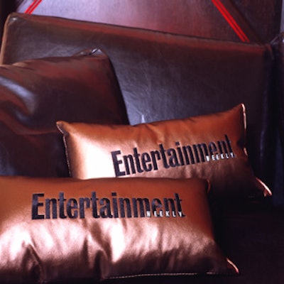 Pillows printed with the magazine’s logo kept with the event’s palette of futuristic colors—all sorts of metallics against black.