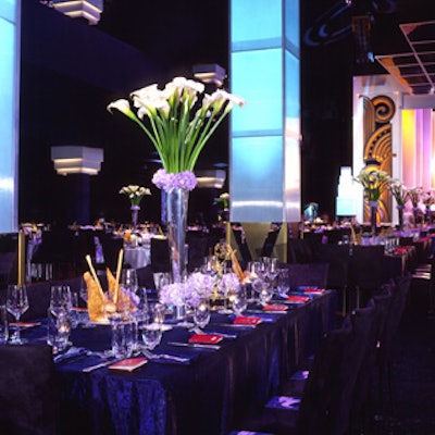 On the tabletops, Mark's Garden filled mirrored vases with lilies, roses, and hydrangeas.