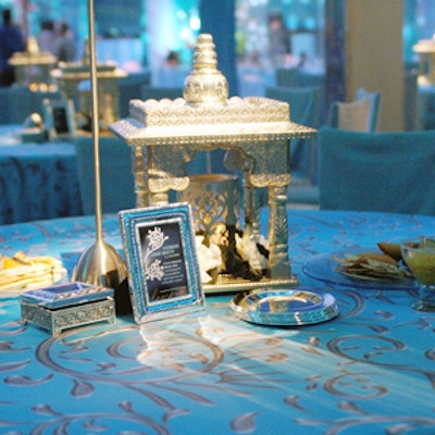 Billy Butchkavitz topped the tables with silvery Hindu temples, normally used for household altars, which served as candleholders.
