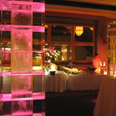 Iceculture provided square ice columns uplit in pink.