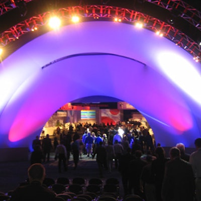 At Canon's Global Expo at the Javits Center, guests watched a promotional video in a bandshell-style auditorium. After the video ended, the rear of the stage lifted to allow entrance to the show floor.