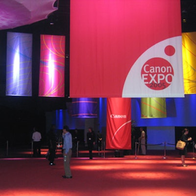 Attendees entered the expo through a darkened hall, lit only by the bright swaths of fabric emblazoned with the Canon logo and event title hung from the ceiling.