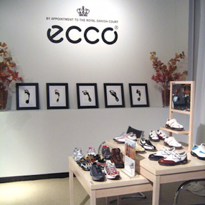 Ecco displayed its footwear on blond wood tables.