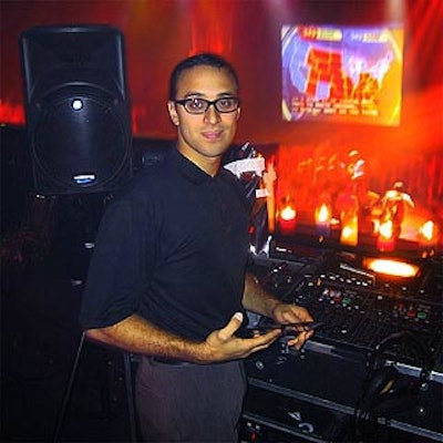 DJ Chris Santos played dance music at Comedy Central's hell-themed Election Night party, while guests watched results.